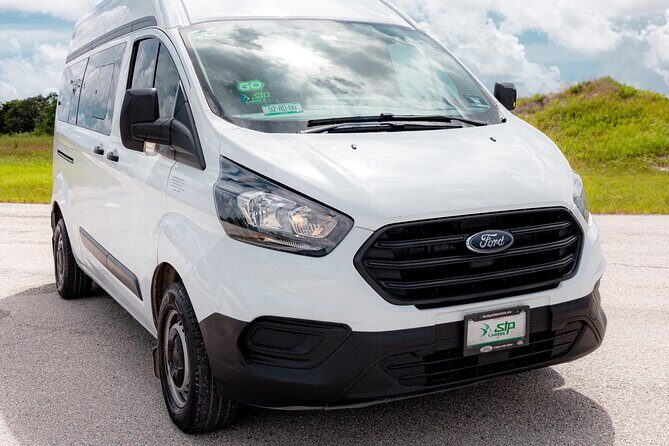 Arrival from Tulum Airport Private Transportation in Minivan - Finding Your Driver: The Black Luxury Service Booth and Name Tablet