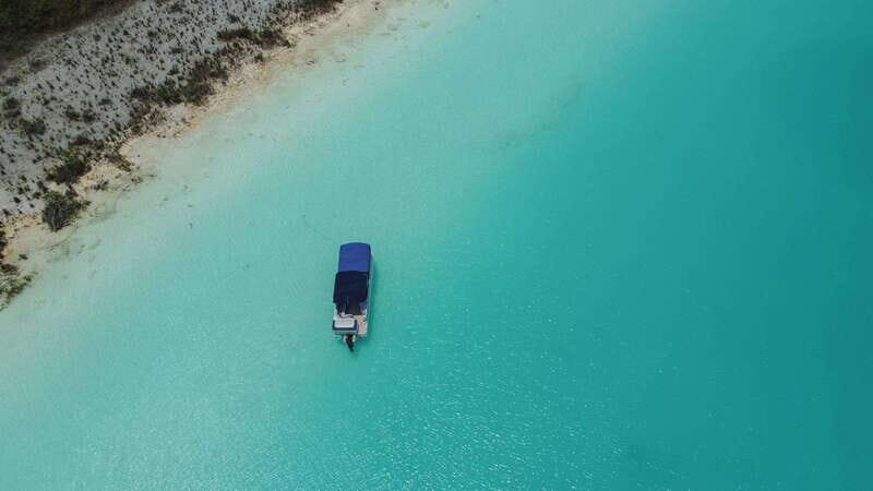 Bacalar: 3-hr Pontoon Boat Tour with Beach Club + Kayaks - Cenote Esmeralda and Cenote Negro: the sinkhole contrast in one run