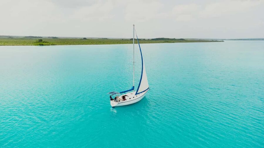 Bacalar Lagoon Sailing Tour with Open Bar and Mexican Lunch - Swimming in turquoise water: timing, stops, and comfort