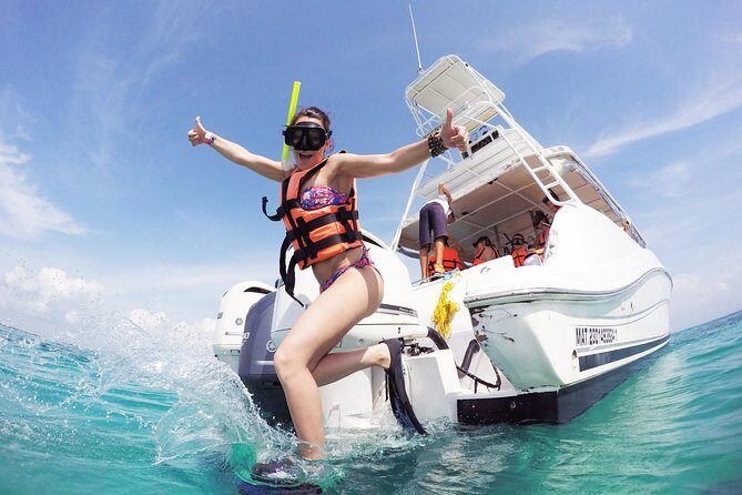 Beach Escape: Isla Contoy and Isla Mujeres with Snorkeling. - Stop 1: Flamingos snack and an easy mental warm-up