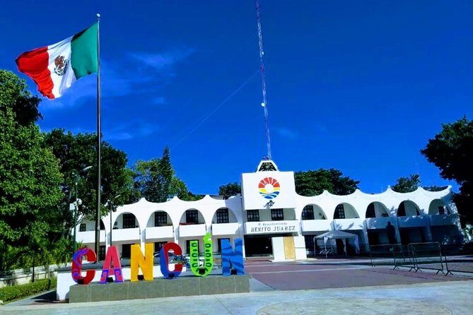 Cancun City Sightseeing and Shopping Tour on a Double Decker bus - Playa Delfines and the Cancun sign: the photo stop with weather rules