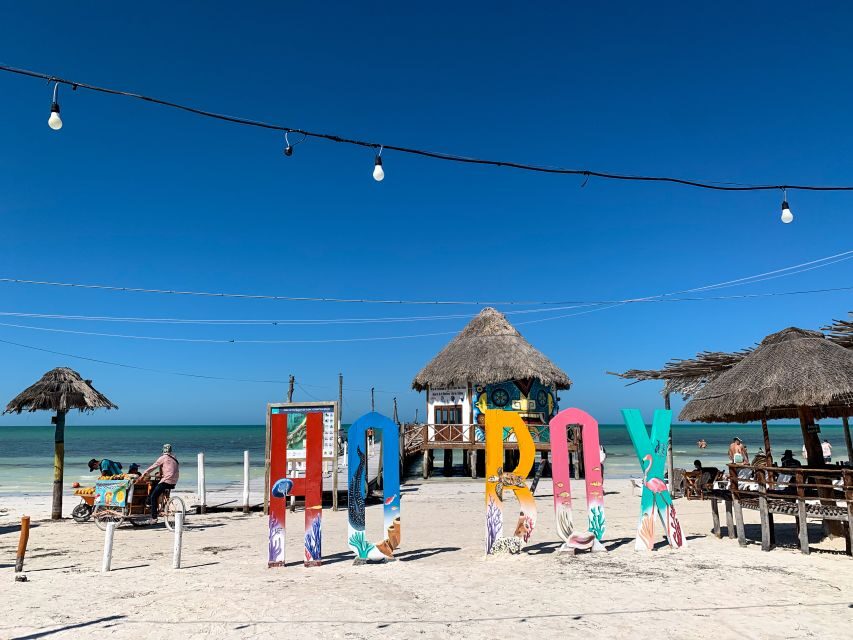 From Cancun or Puerto Morelos: Holbox Boat Tour with Lunch - Hoyo Negro Yalahau Cenote Swim: Water Time in Nature