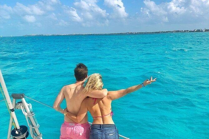 Isla Mujeres Catamaran Tour with Snorkel, Open bar and Transport - Playa Norte anchor time: stunning views, but plan around the “tour stop” vibe