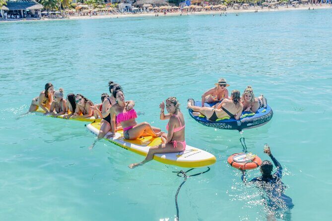 Isla Mujeres Catamaran Tour with Snorkel, Open bar and Transport - Isla Mujeres deck-to-shore: music, sunset energy, and a small downtown window