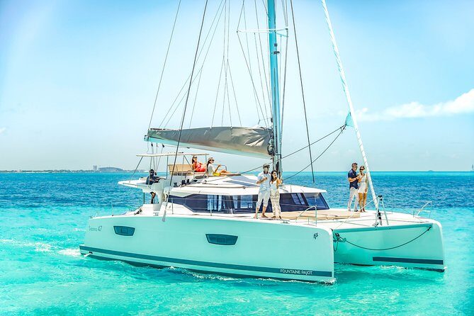 Isla Mujeres luxury catamaran with premium open bar and lunch - Onboard experience: drinks, snacks, and what snorkeling may look like